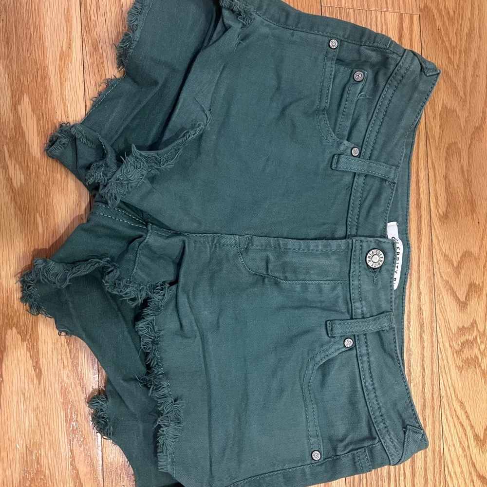 Celebrity Pink Green Jean Shorts with Distressed Look and High-Waisted Fit